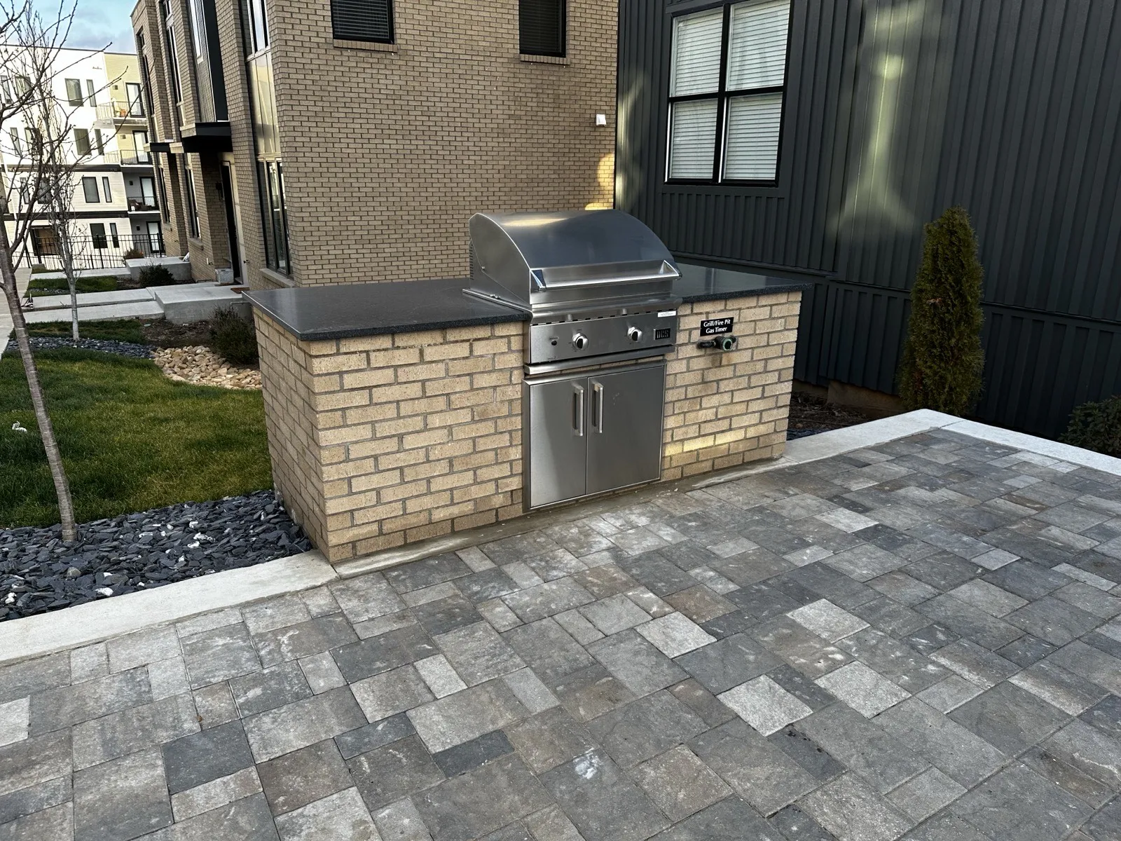 Commercial outdoor kitchen grill with masonry surround