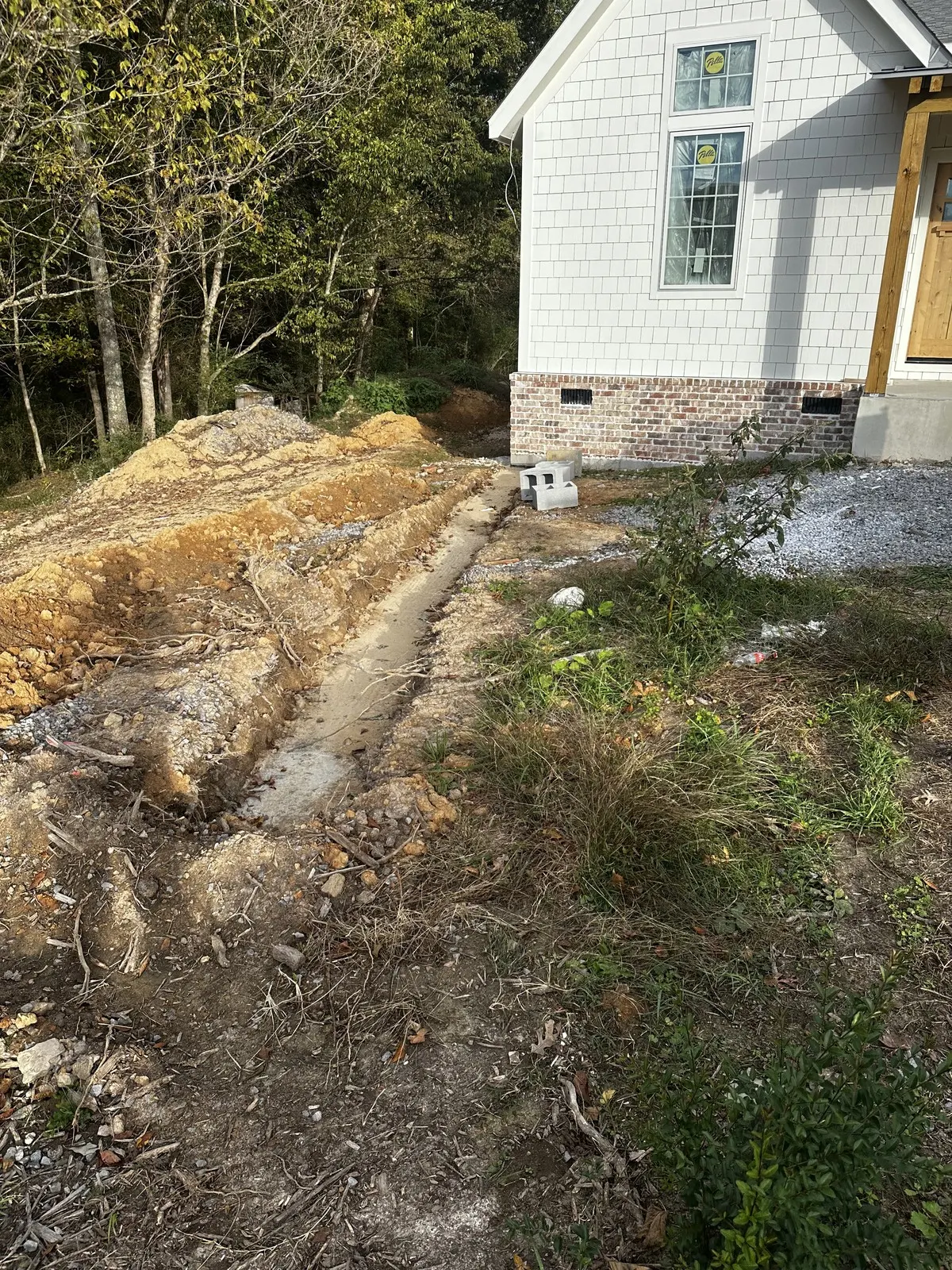 Excavation and footing before brick retaining wall