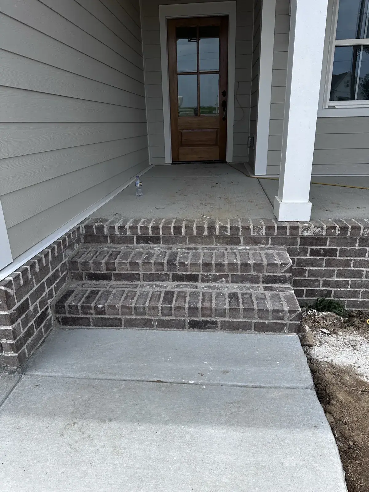 Front porch steps after masonry rebuild